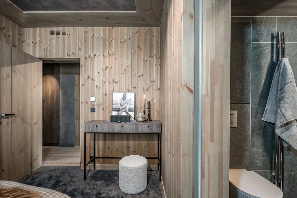 Apartment A11, Kvitfjell, Norway: bedroom dressing table and adjoining bathroom