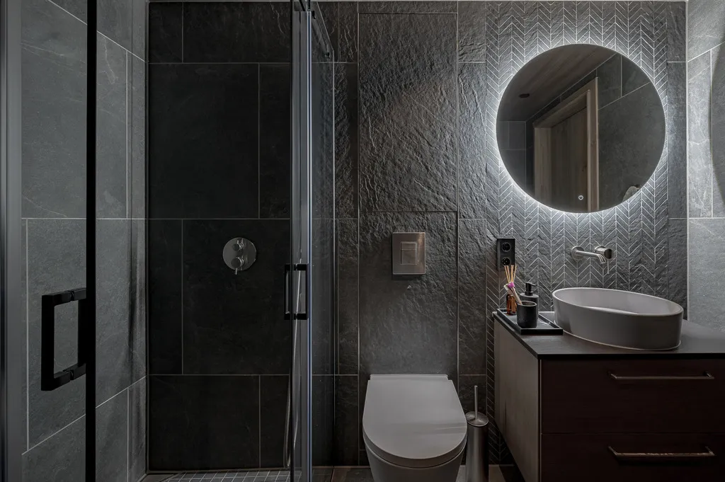 Apartment A11, Kvitfjell, Norway: bathroom with a glass shower and illuminated mirror