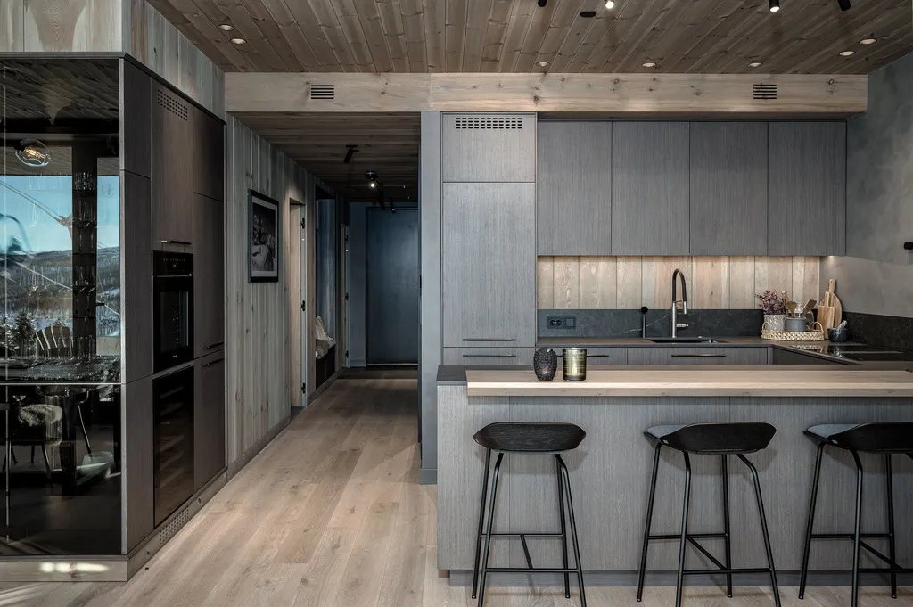 Apartment A11, Kvitfjell, Norway: fitted kitchen, breakfast bar and timber-lined hallway