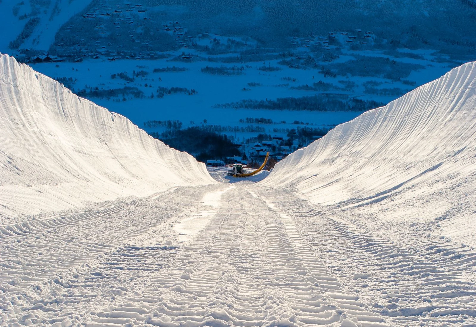 A snow-covered halfpipe overlooking the mountain valley at Geilo ski resort, Norway